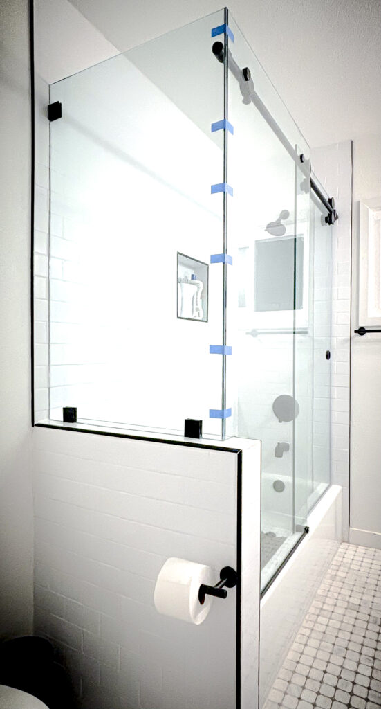 Opitwhite frameless glass shower doors with Euroglide Unovero System