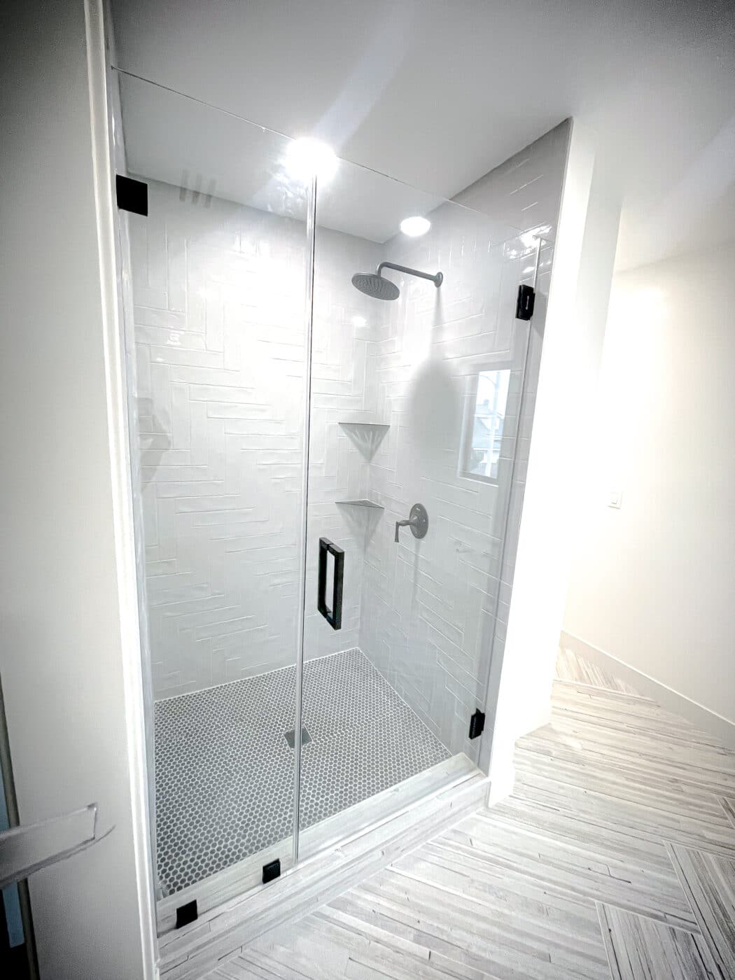 Hinged frameless shower door + fixed panel &mdash; matte black hardware &mdash; mission viejo