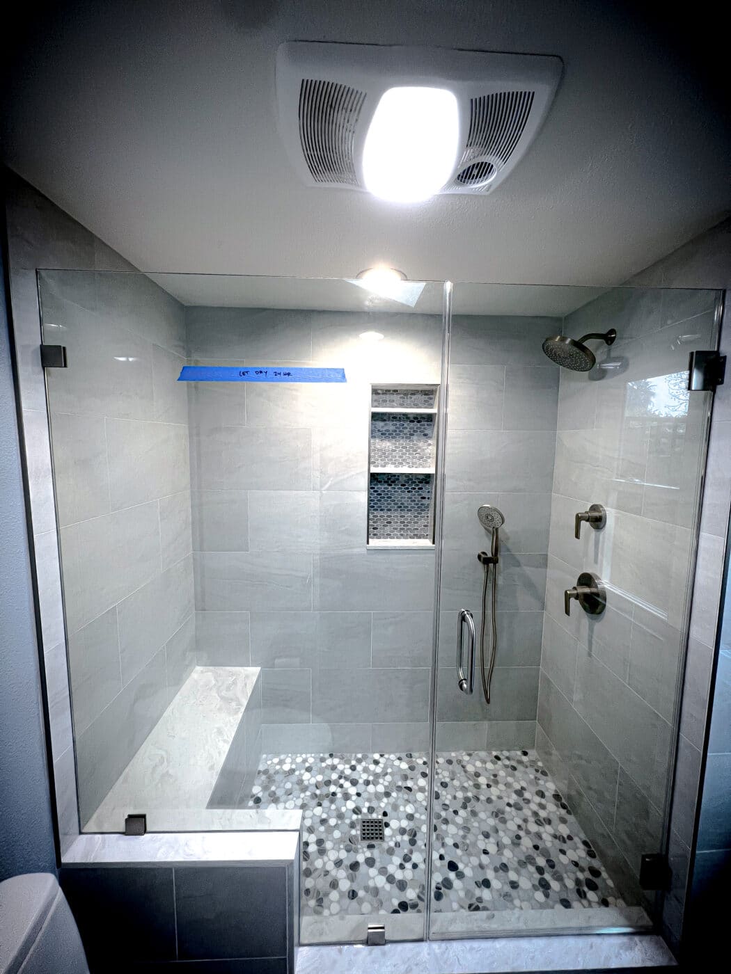 Hinged frameless shower door + fixed panel + bench cutout &mdash; chrome &mdash; laguna niguel