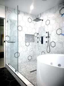 unique tile consideration in this open shower with splash panel