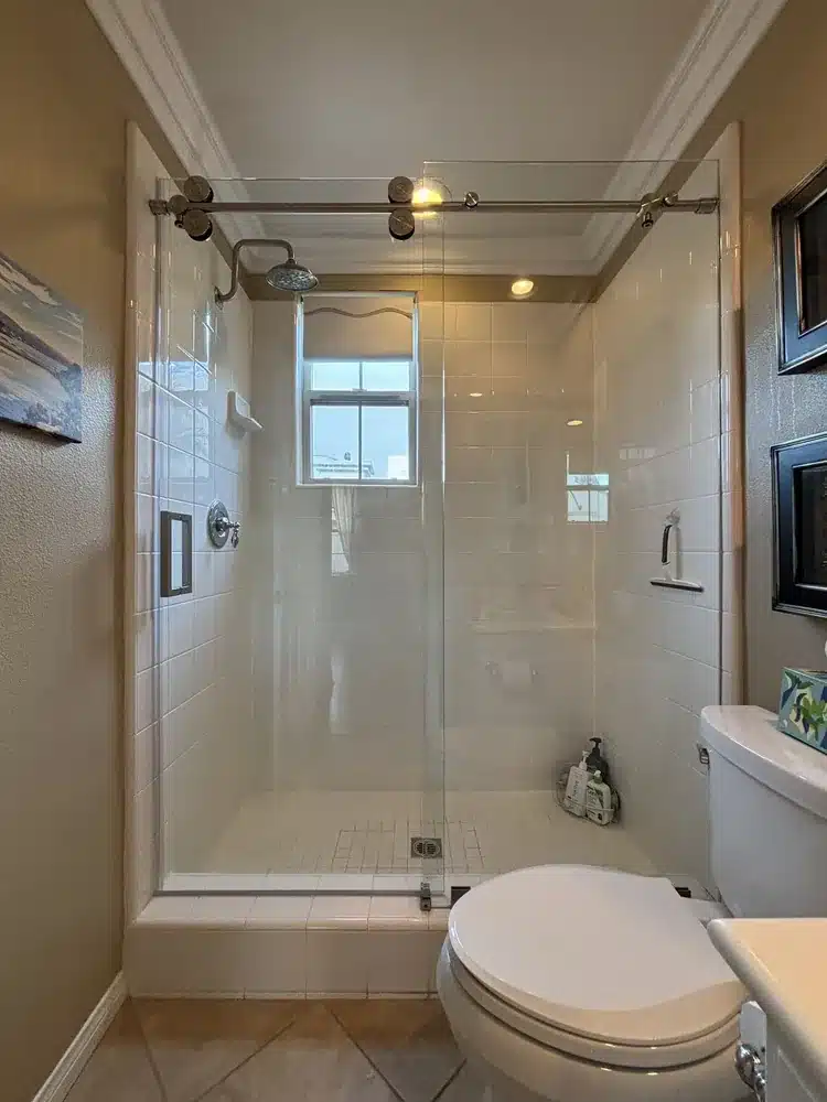 Chrome Euroglide sliding shower door from a two-enclosure San Clemente project