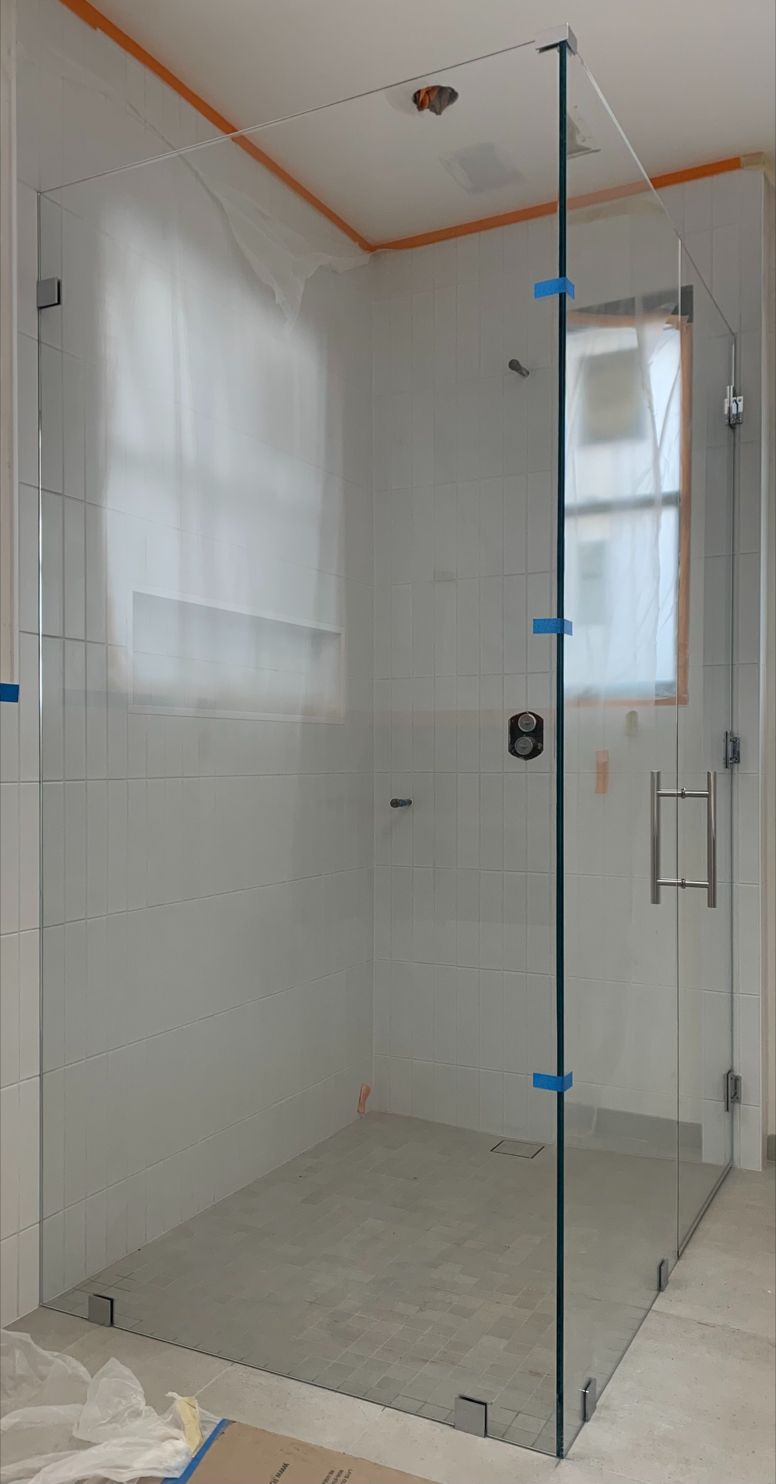 Half-inch Starphire corner shower with a 165-pound return panel in Encinitas