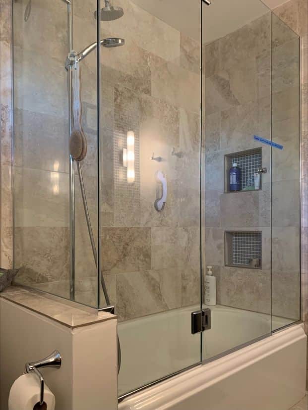 Panel-door-panel corner enclosure in channel on a cast-iron tub in Escondido