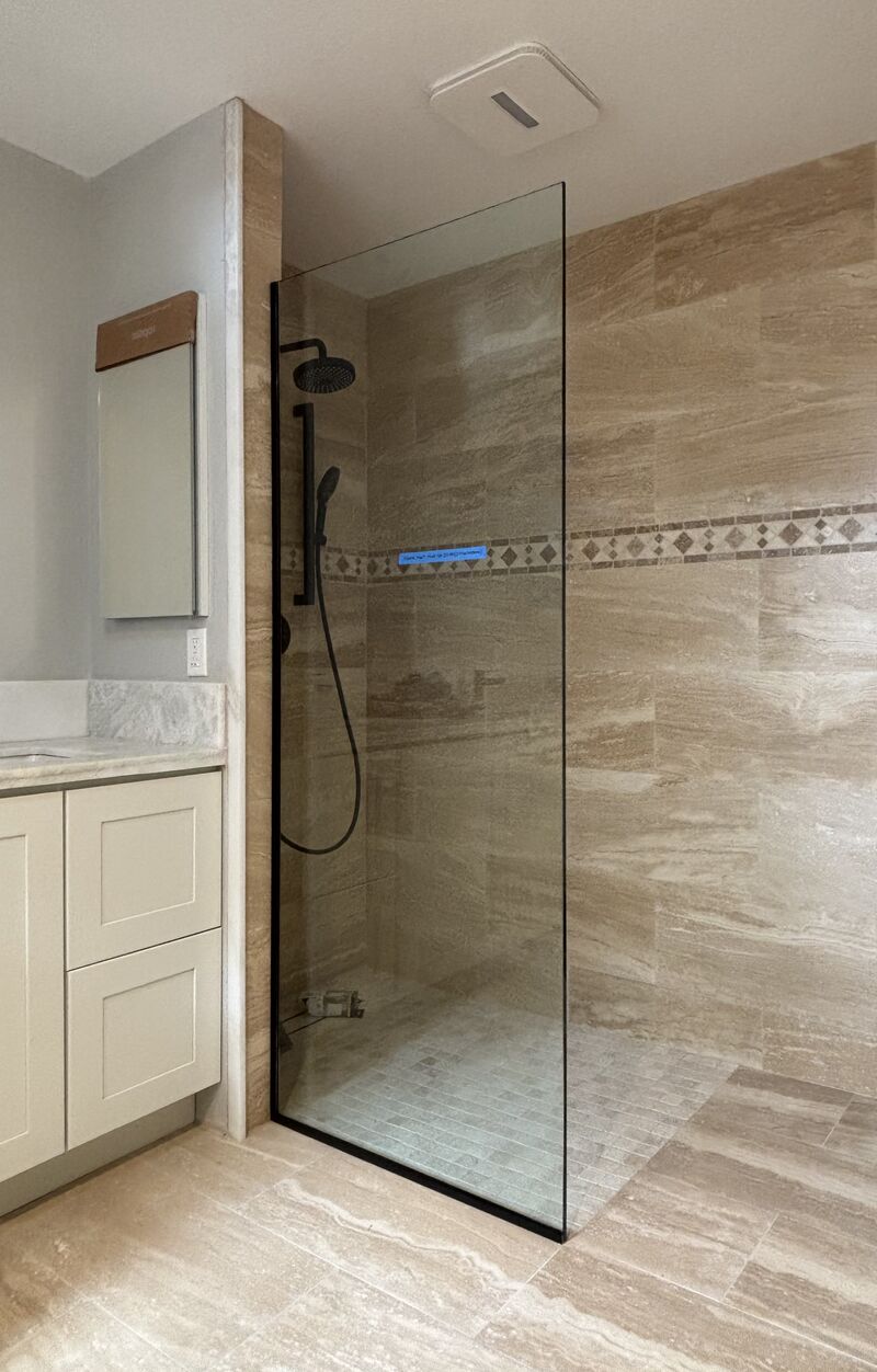 Half-inch 114-pound fixed shower panel installed in Huntington Beach