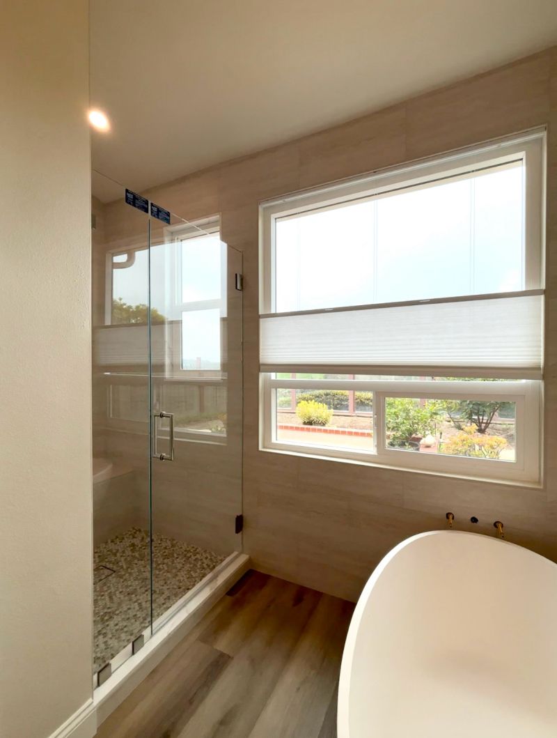 Opti-White low-iron door-and-inline shower enclosure with EnduroShield in Laguna Niguel