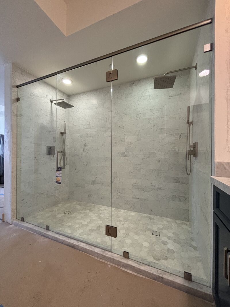 Wide 96-inch panel-door-panel shower enclosure in a Downtown Long Beach condominium