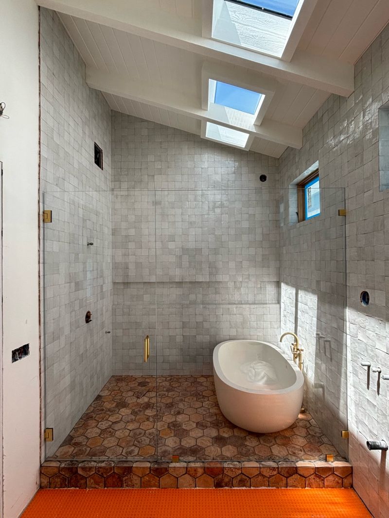 Gold-hardware wet-room enclosure with a 237-pound inline panel in Naples Island, Long Beach