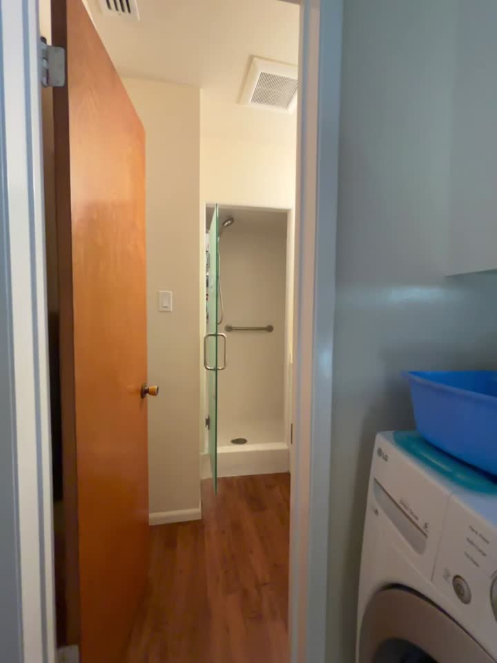 Patterned rain-glass privacy shower door treated with EnduroShield in Long Beach