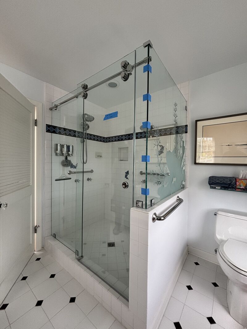 Euroglide sliding shower enclosure with customer-designed etched glass in Los Angeles