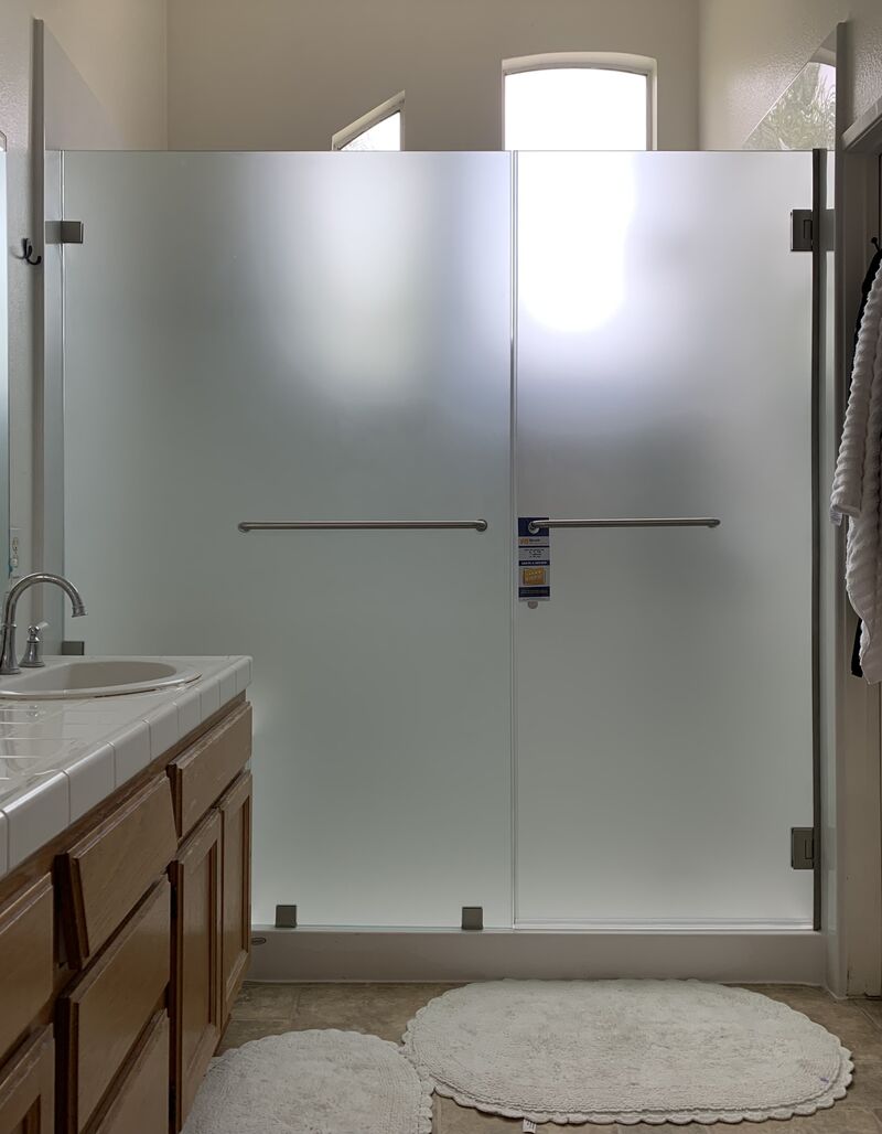 Frosted frameless shower door and heavy inline panel in Harbor City, Los Angeles