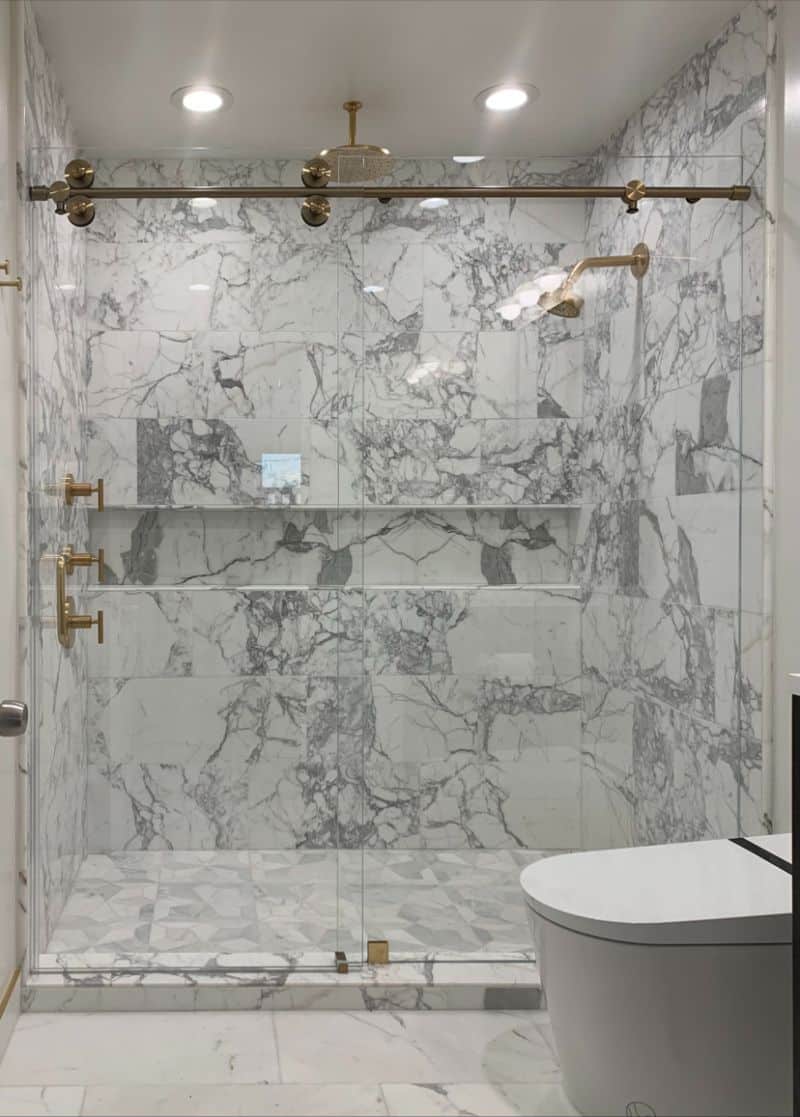Euroglide sliding frameless shower enclosure with brass hardware in Westchester, Los Angeles