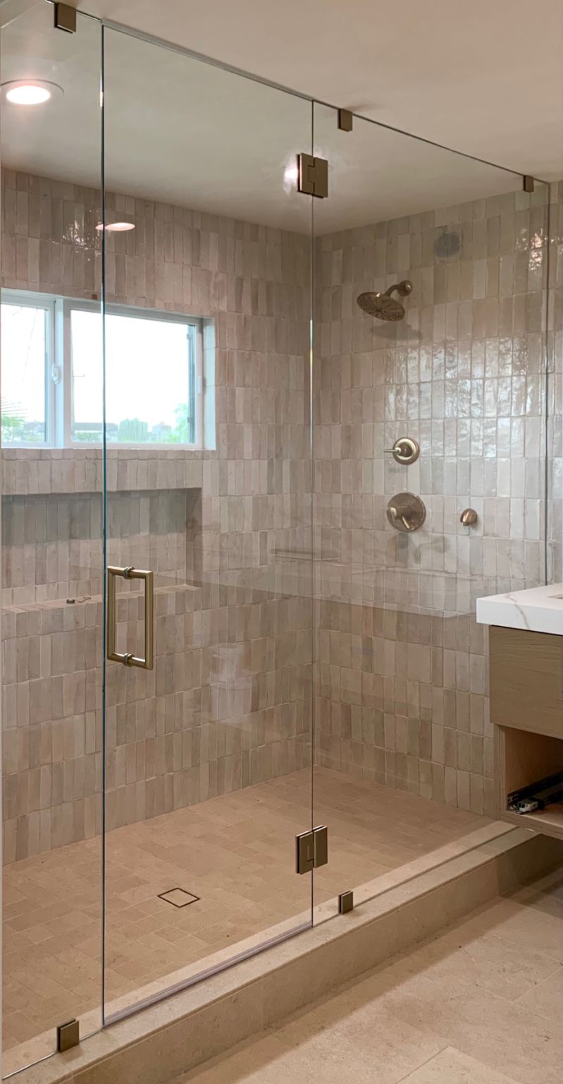 Finished floor-to-ceiling frameless panel-door-panel enclosure in Westchester, Los Angeles