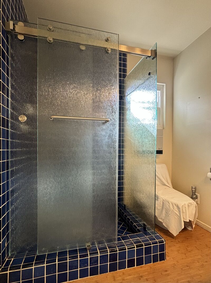 Double Euroglide90 sliding shower enclosure with rain-pattern privacy glass in Manhattan Beach
