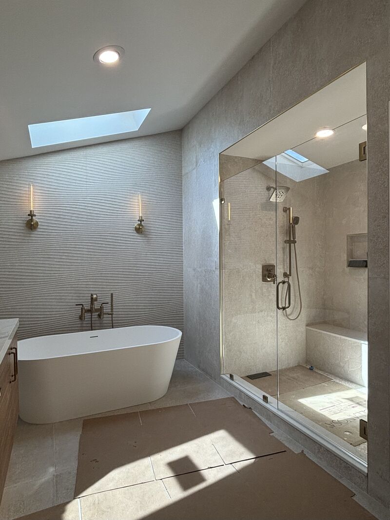 Opti-White low-iron frameless shower door with inline glass installed in Newport Beach