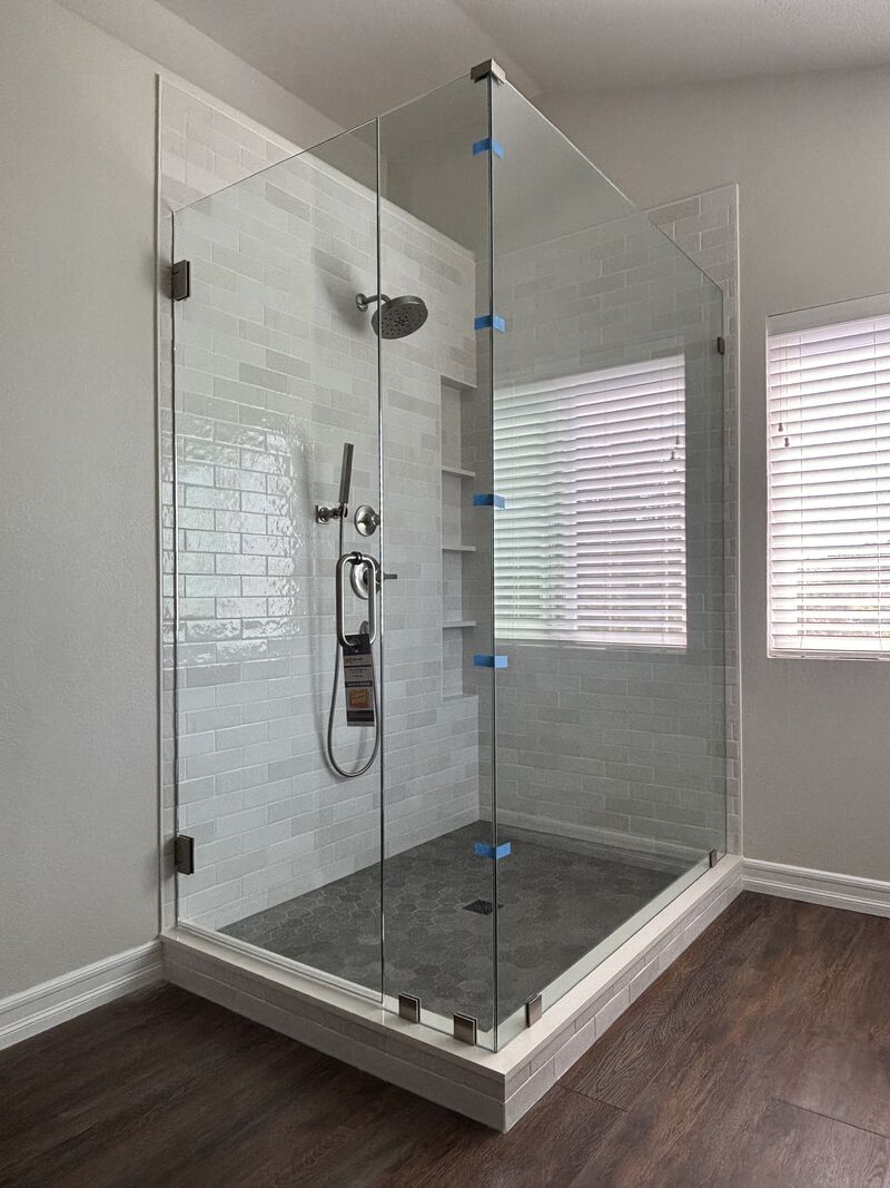 In-and-out swinging frameless corner shower in Oceanside