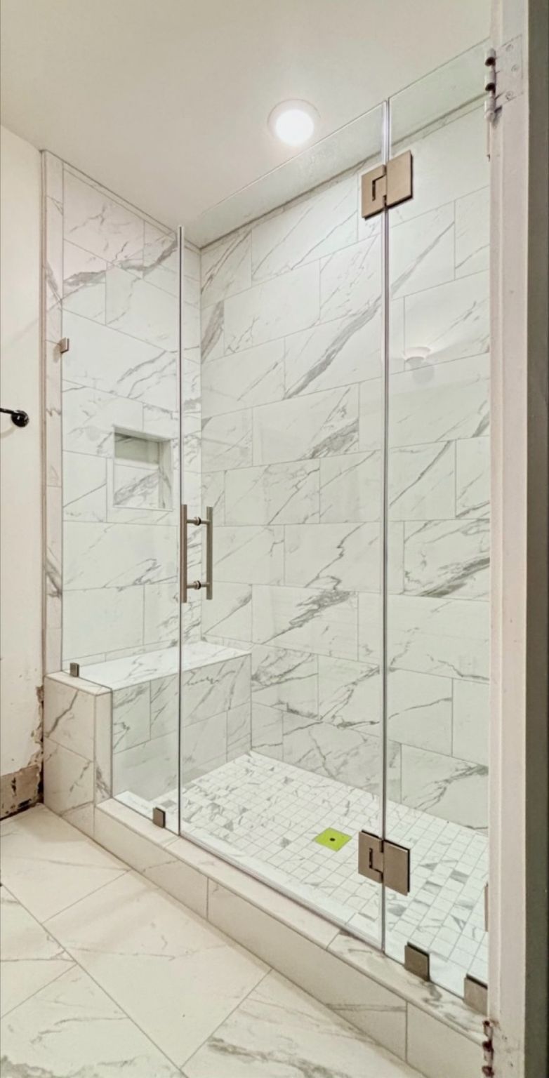Panel-door-panel shower enclosure with half-inch bench-notched support glass in Pasadena