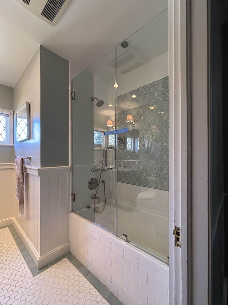 Door and inline glass on a tub with polished-nickel hardware in Pasadena