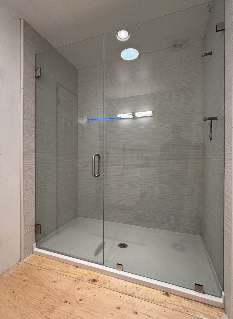 83-inch-tall in-and-out swinging shower door and inline glass in Redondo Beach