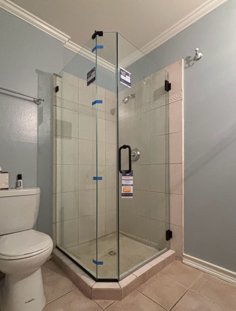 Completed frameless angled shower enclosure replacing an old framed unit in a Redondo Beach condo