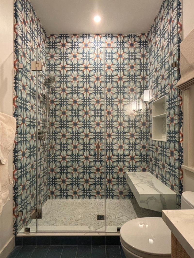 Half-inch support panel and glass-to-glass hinges beside patterned shower tile in Redondo Beach