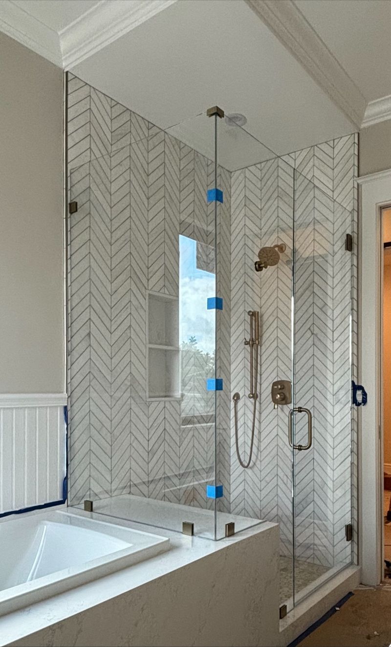 90-inch-tall corner shower enclosure on a tub deck in San Diego