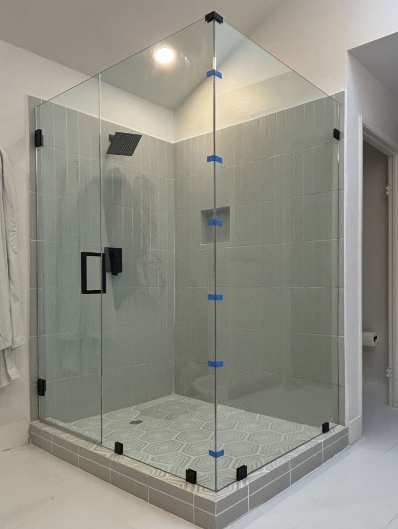 Clear frameless corner shower enclosure in San Diego