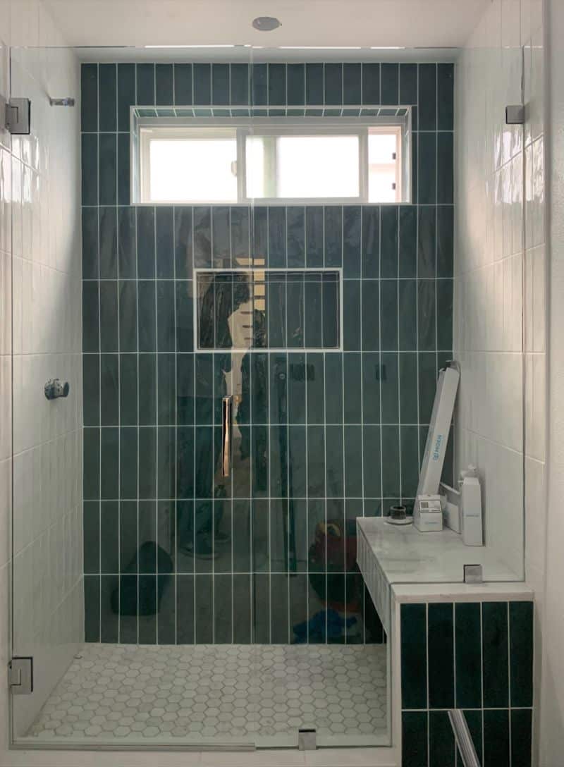 In-and-out swinging shower door and bench-notched inline panel in Torrance