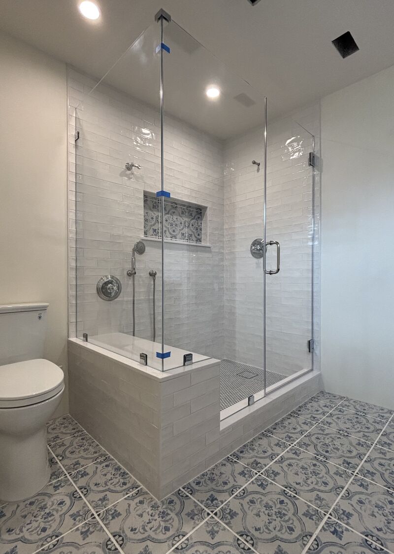Opti-White low-iron corner shower glass with a bench notch in Torrance