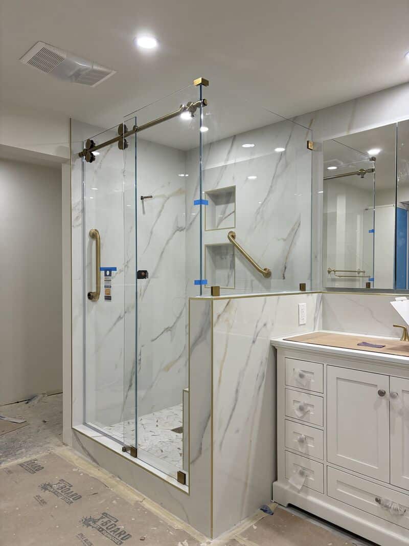 Opti-White low-iron corner sliding shower enclosure on a pony wall in Torrance